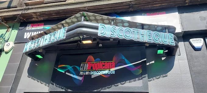 Bar team serving neon cocktails